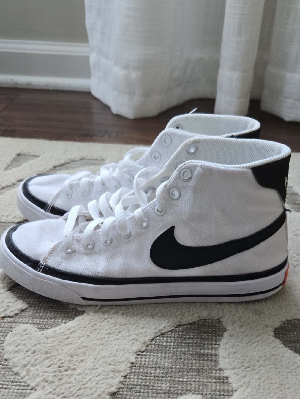Nike White High-Top Canvas Sneakers with Black Swoosh Accent